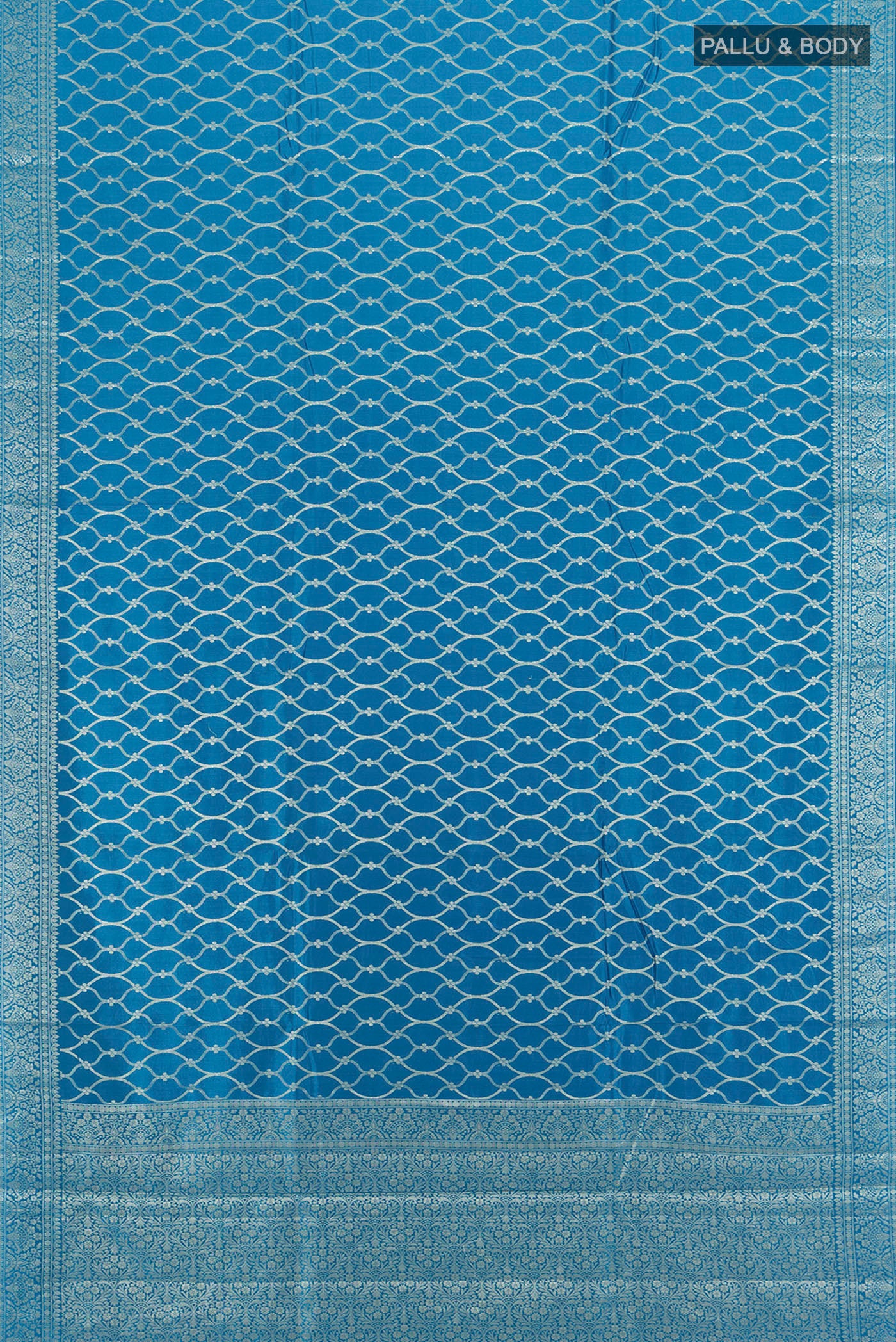 Flat view of Dark Blue Banarasi Raw Silk Saree with Zari Butta on the body and Silk Border. 