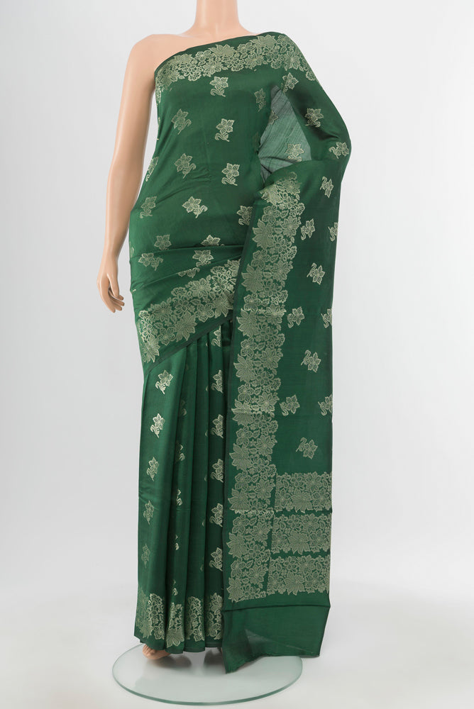 Mint Green Banarasi Raw Silk Saree with Zari Butta on the body and Silk Border.  displayed on a mannequin