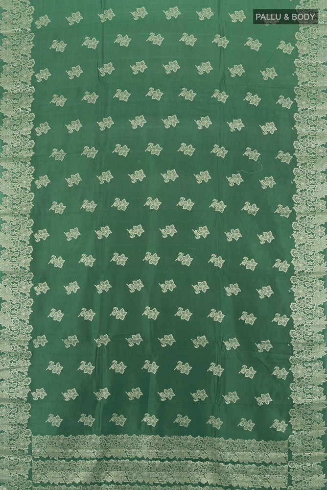 Flat view of Mint Green Banarasi Raw Silk Saree with Zari Butta on the body and Silk Border. 