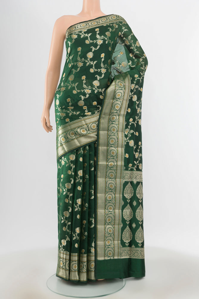 Pure Silk Pure Zari Mint Green Banarasi Raw Saree with Zari Butta on the body and Silk Border.  displayed on a mannequin