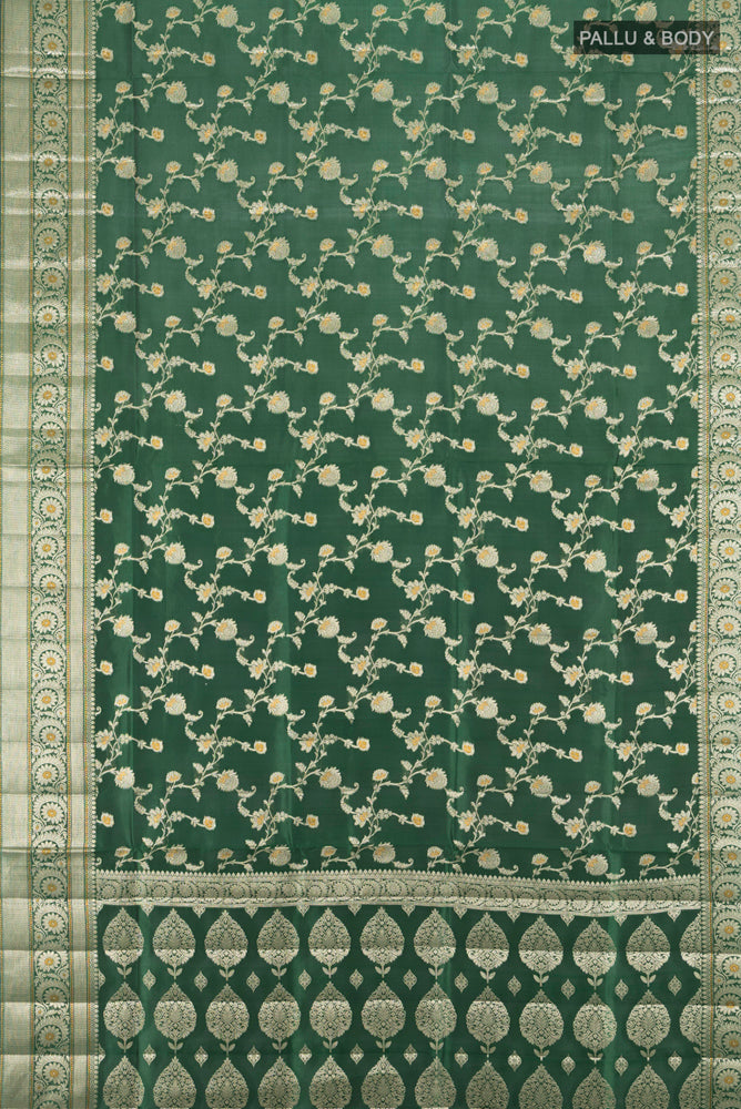 Flat view of Pure Silk Pure Zari Mint Green Banarasi Raw Saree with Zari Butta on the body and Silk Border. 