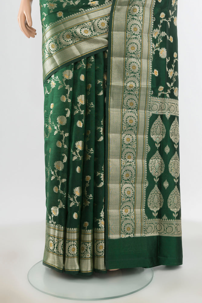 Pleats and pallu of Pure Silk Pure Zari Mint Green Banarasi Raw Saree with Zari Butta on the body and Silk Border. 