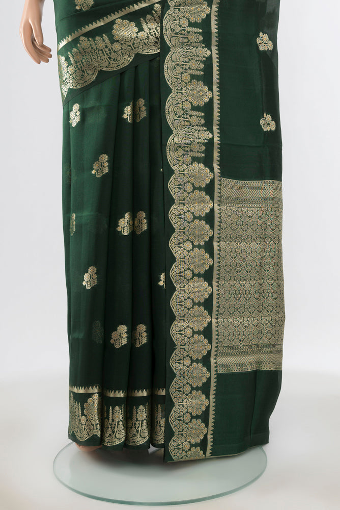 Pleats and pallu of Pure Silk Pure Zari Mint Green Banarasi Saree with Zari Butta on the body and Silk Border. 