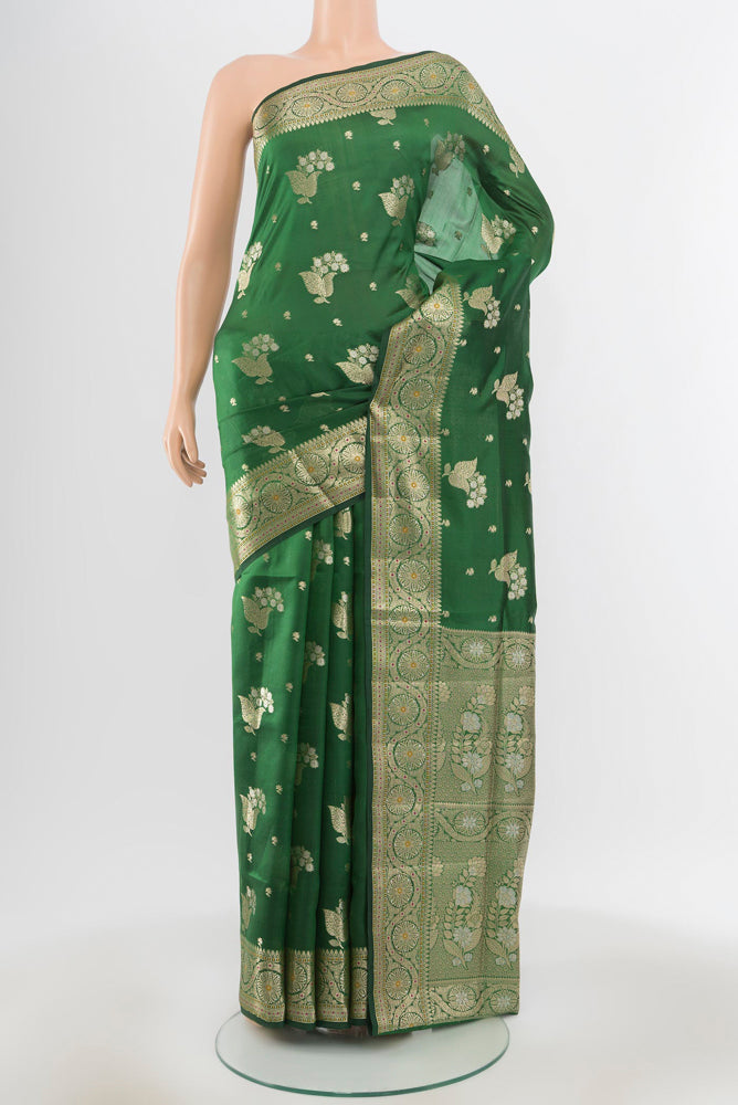 Pure Silk Pure Zari Bottle Green Banarasi Raw Saree with Zari Butta on the body and Silk Border.  displayed on a mannequin