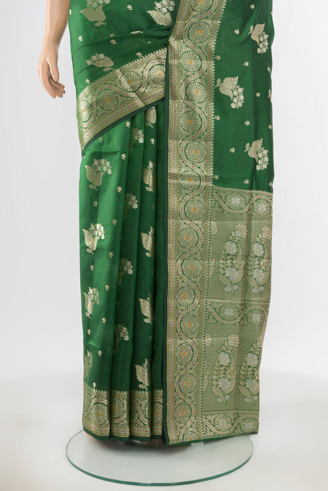 Pleats and pallu of Pure Silk Pure Zari Bottle Green Banarasi Raw Saree with Zari Butta on the body and Silk Border. 