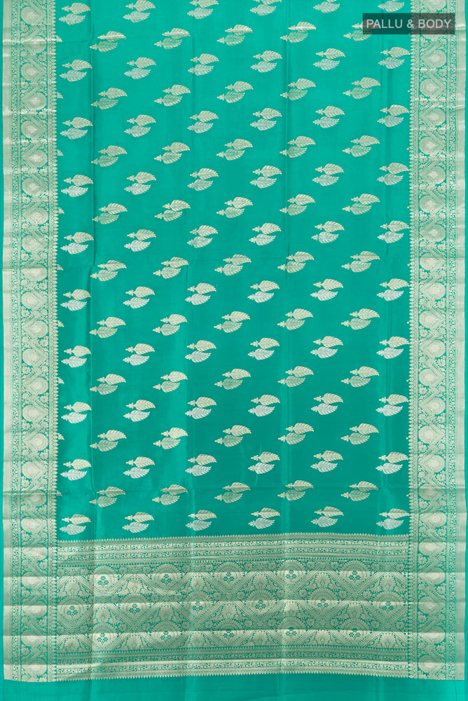 Flat view of Light Blue Banarasi Raw Silk Saree with Zari Butta on the body and Silk Border. 