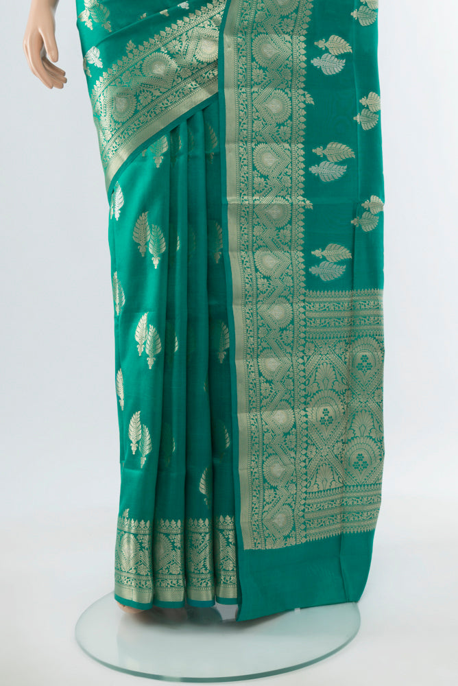 Pleats and pallu of Light Blue Banarasi Raw Silk Saree with Zari Butta on the body and Silk Border. 