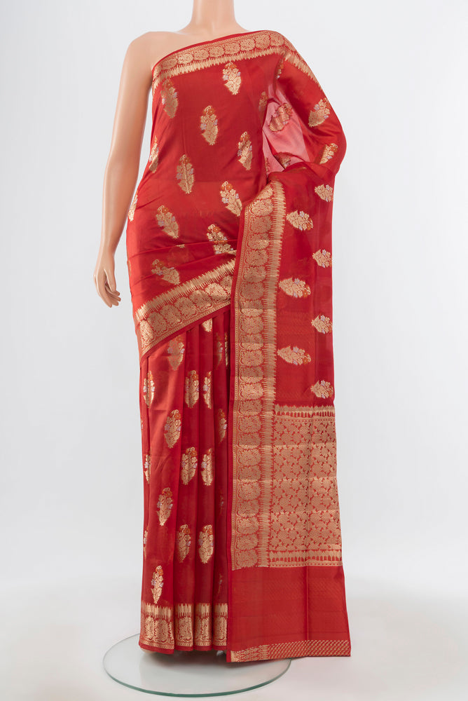 Pure Silk Pure Zari Bronze Banarasi Raw Saree with Zari Butta on the body and Silk Border.  displayed on a mannequin