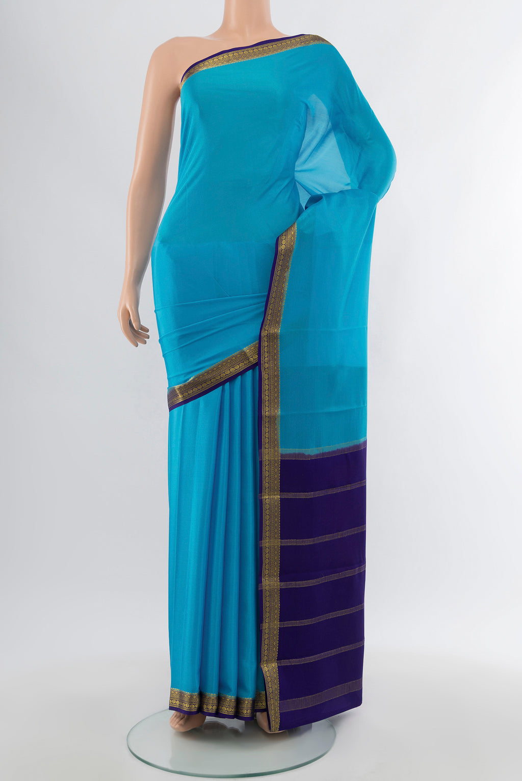 Light Blue Mysore Crepe Saree with Plain Body and Zari Border.  displayed on a mannequin