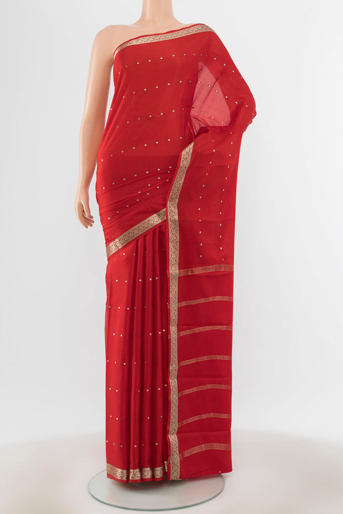 Red Mysore Crepe Saree with Plain Body and Silk Border.  displayed on a mannequin