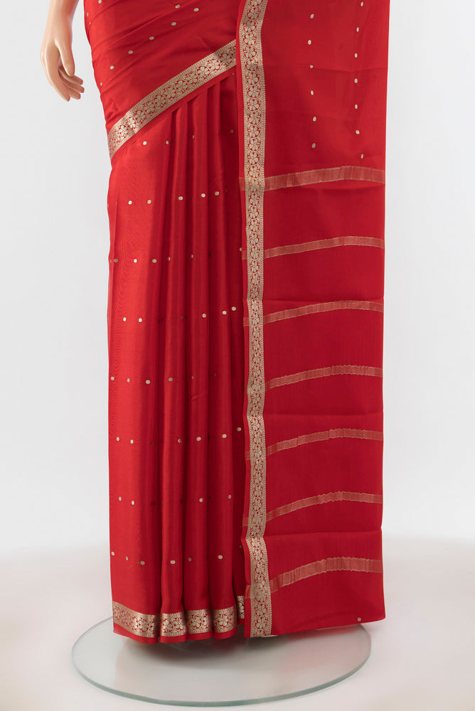 Pleats and pallu of Red Mysore Crepe Saree with Plain Body and Silk Border. 