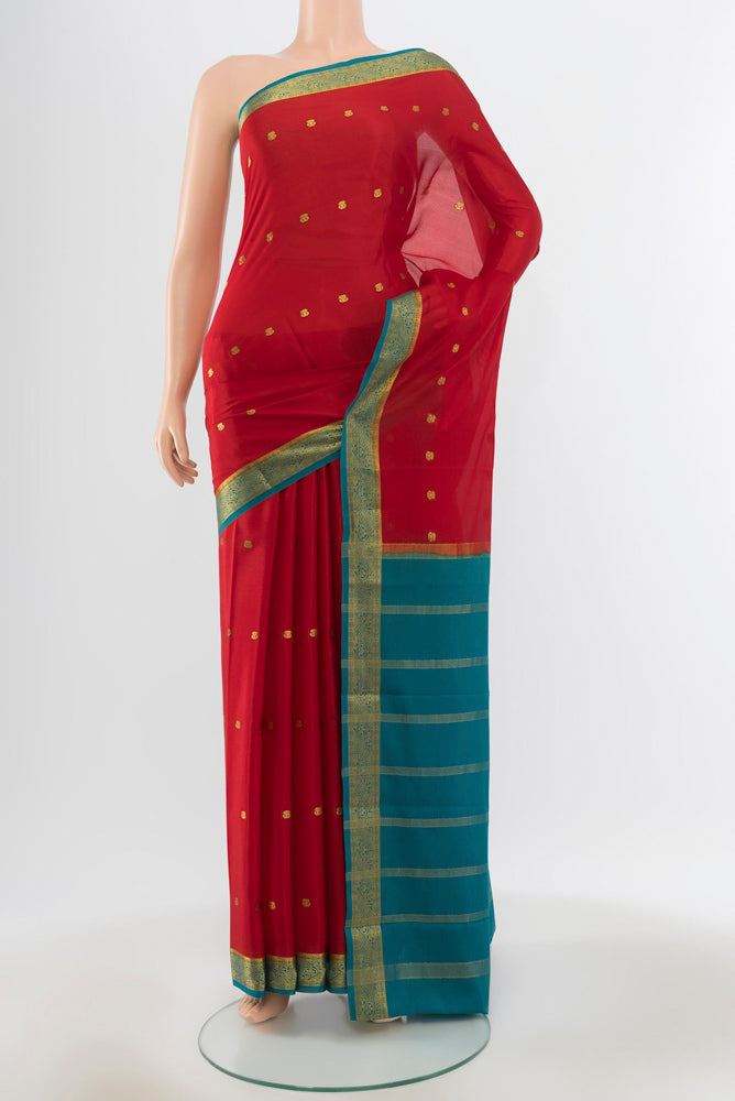 Pure Silk Pure Zari Maroon Mysore Crepe Saree with Zari Butta on the body and Silk Border.  displayed on a mannequin