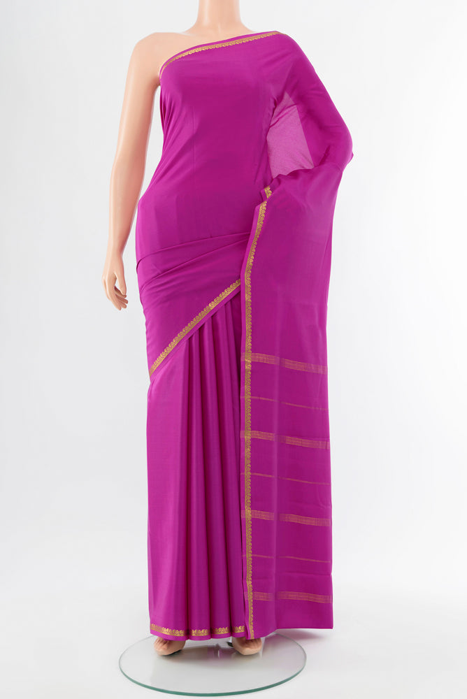 Purple Mysore Crepe Saree with Plain Body and Silk Border.  displayed on a mannequin
