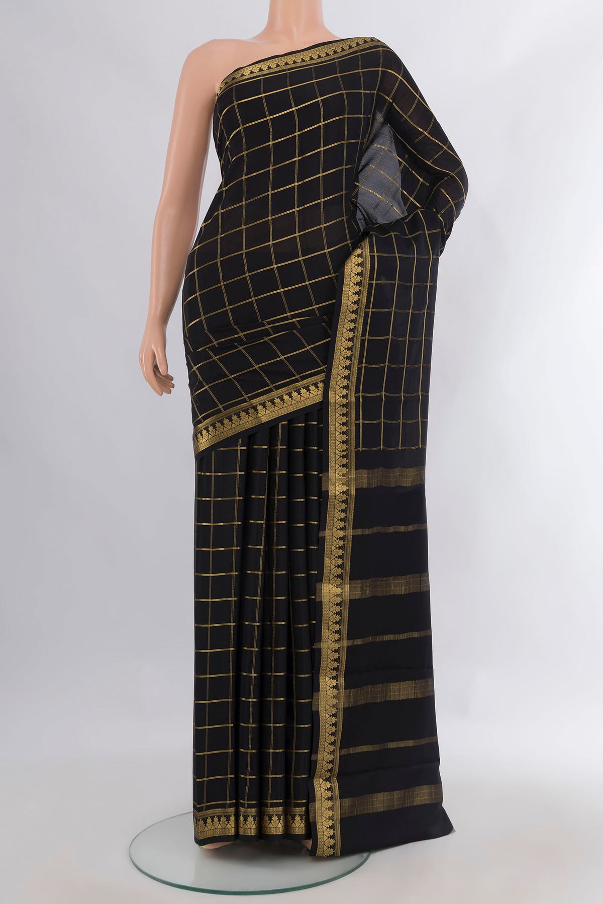 Black Mysore Crepe Saree with Checked design on the body and Zari Border.  displayed on a mannequin
