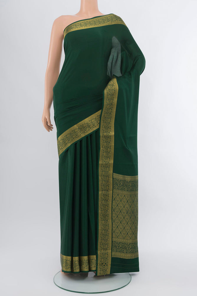 Mint Green Mysore Crepe Saree with Plain Body and Silk Border.  displayed on a mannequin