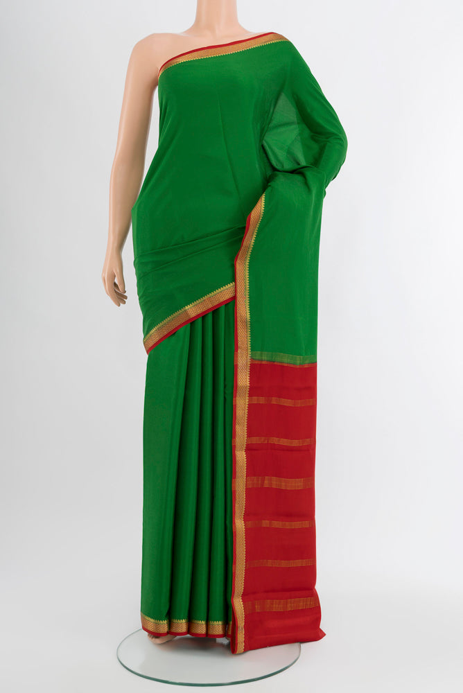 Mint Green Mysore Crepe Saree with Plain Body and Silk Border.  displayed on a mannequin