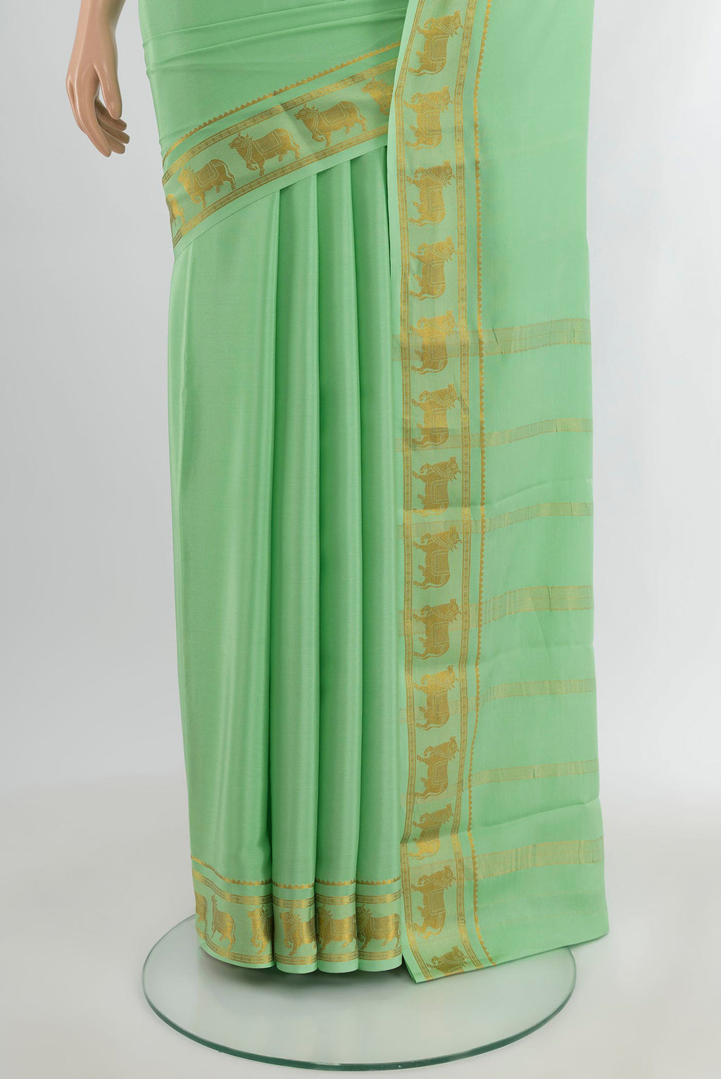 Pleats and pallu of Pista Green Mysore Crepe Saree with Plain Body and Zari Border. 