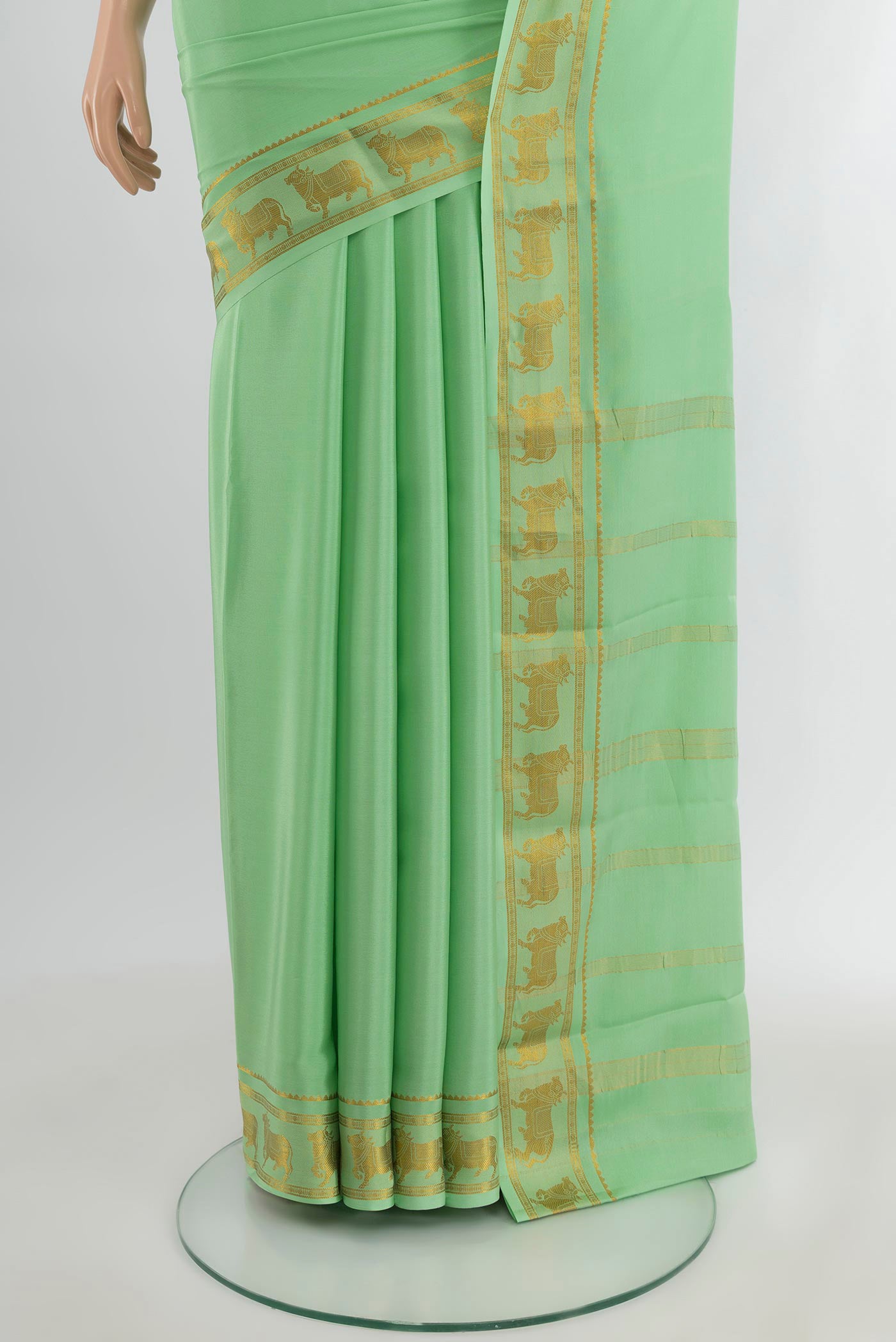Pleats and pallu of Pista Green Mysore Crepe Saree with Plain Body and Zari Border. 