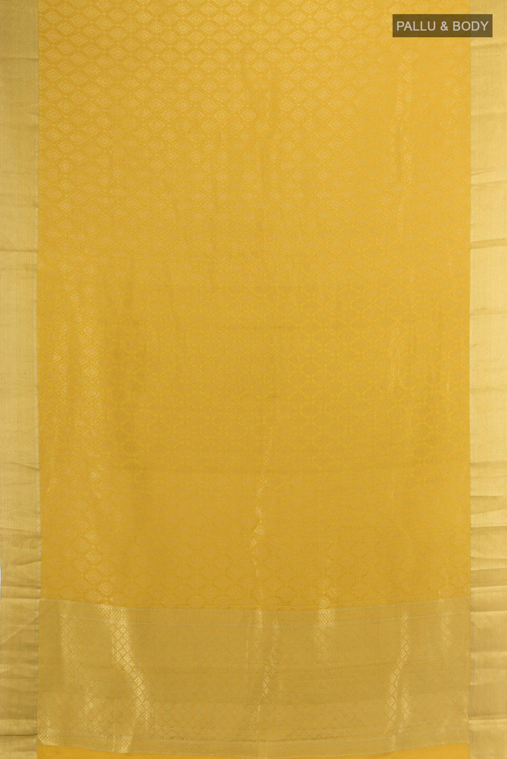 Flat view of Mustard Mysore Crepe Saree with Zari Brocade on the body and Zari Border. 