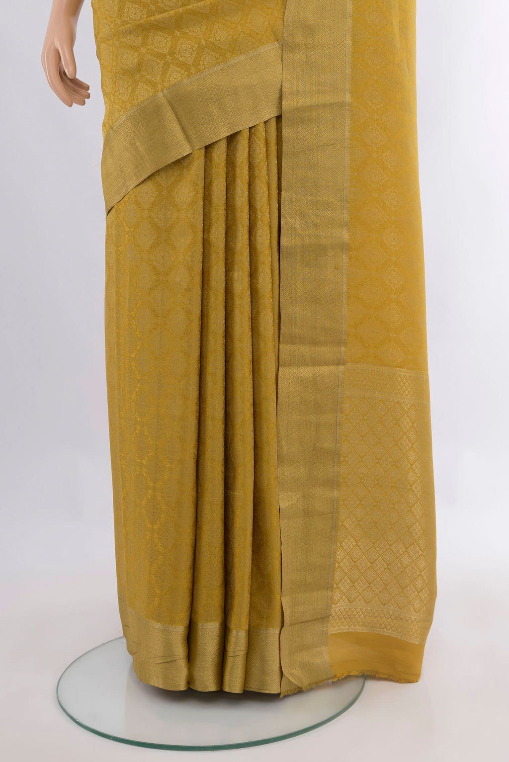 Pleats and pallu of Mustard Mysore Crepe Saree with Zari Brocade on the body and Zari Border. 