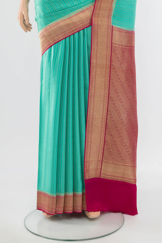 Pleats and pallu of Sky Blue Mysore Crepe Saree with Zari Butta on the body and Silk Border. 