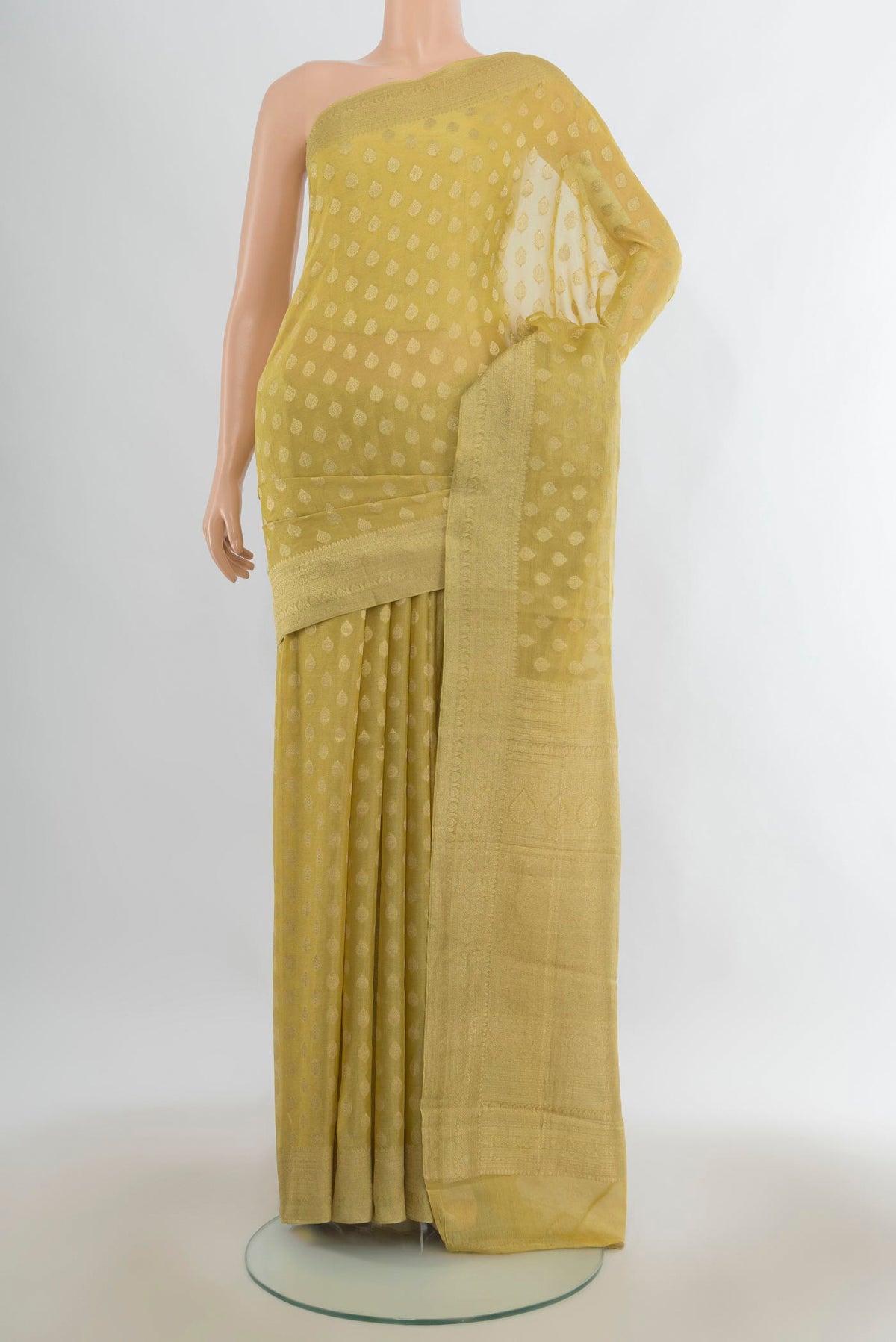 Yellow Mysore Georgette Saree with Zari Butta on the body and Zari Border.  displayed on a mannequin