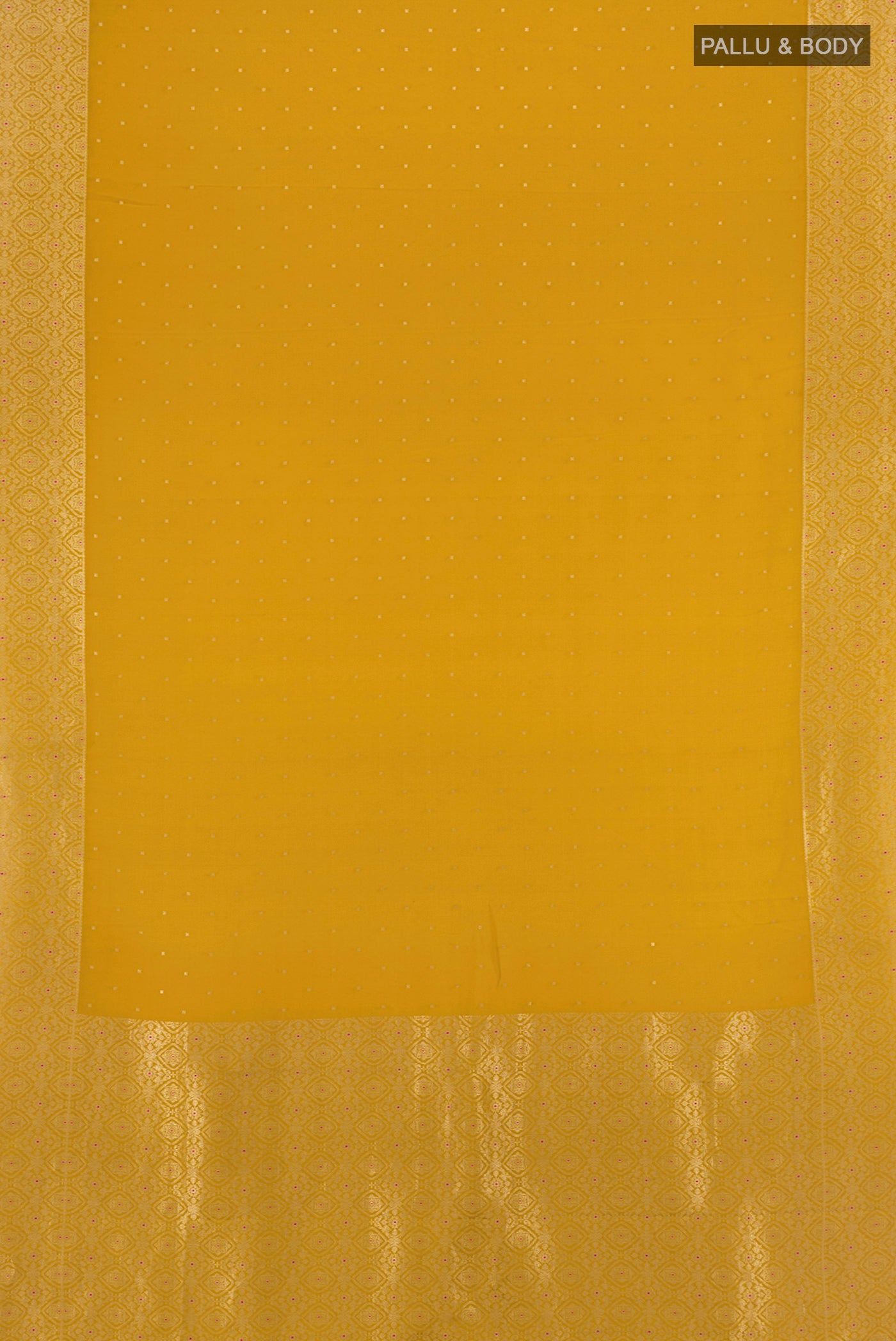 Flat view of Mustard Mysore Crepe Saree with Zari Butta on the body and Zari Border. 