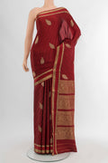 Maroon Mysore Crepe Saree with Zari Butta on the body and Zari Border.  displayed on a mannequin