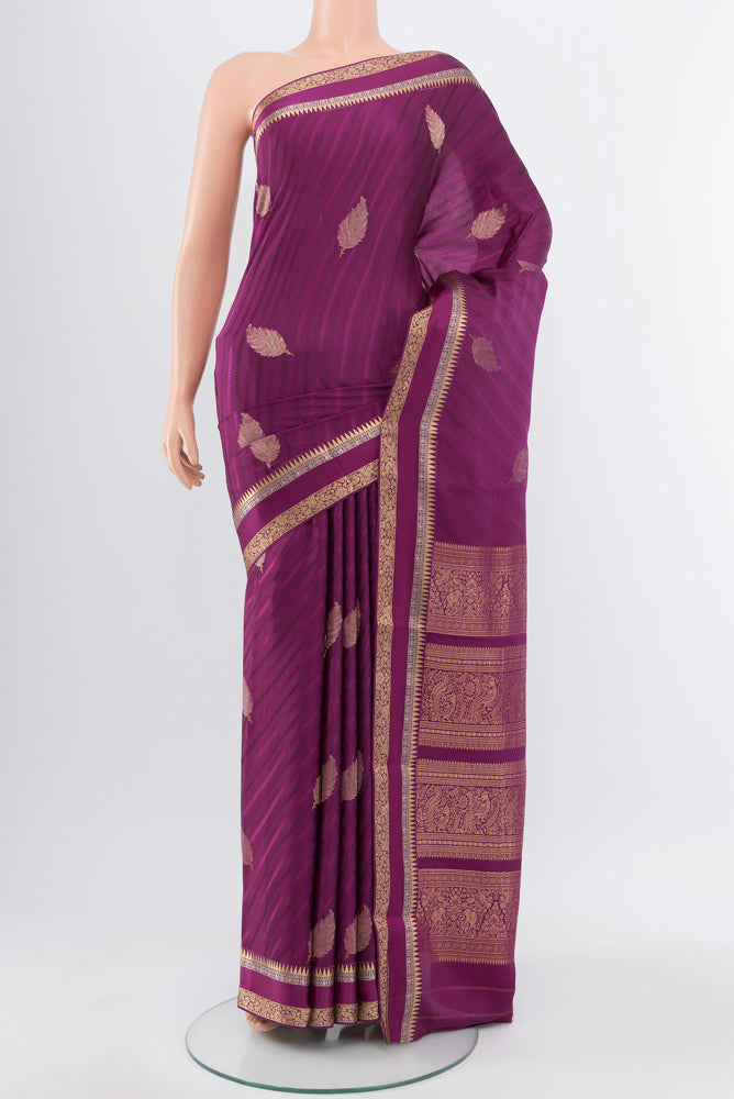 Purple Georgette Saree with Zari Butta on the body and Silk Border.  displayed on a mannequin