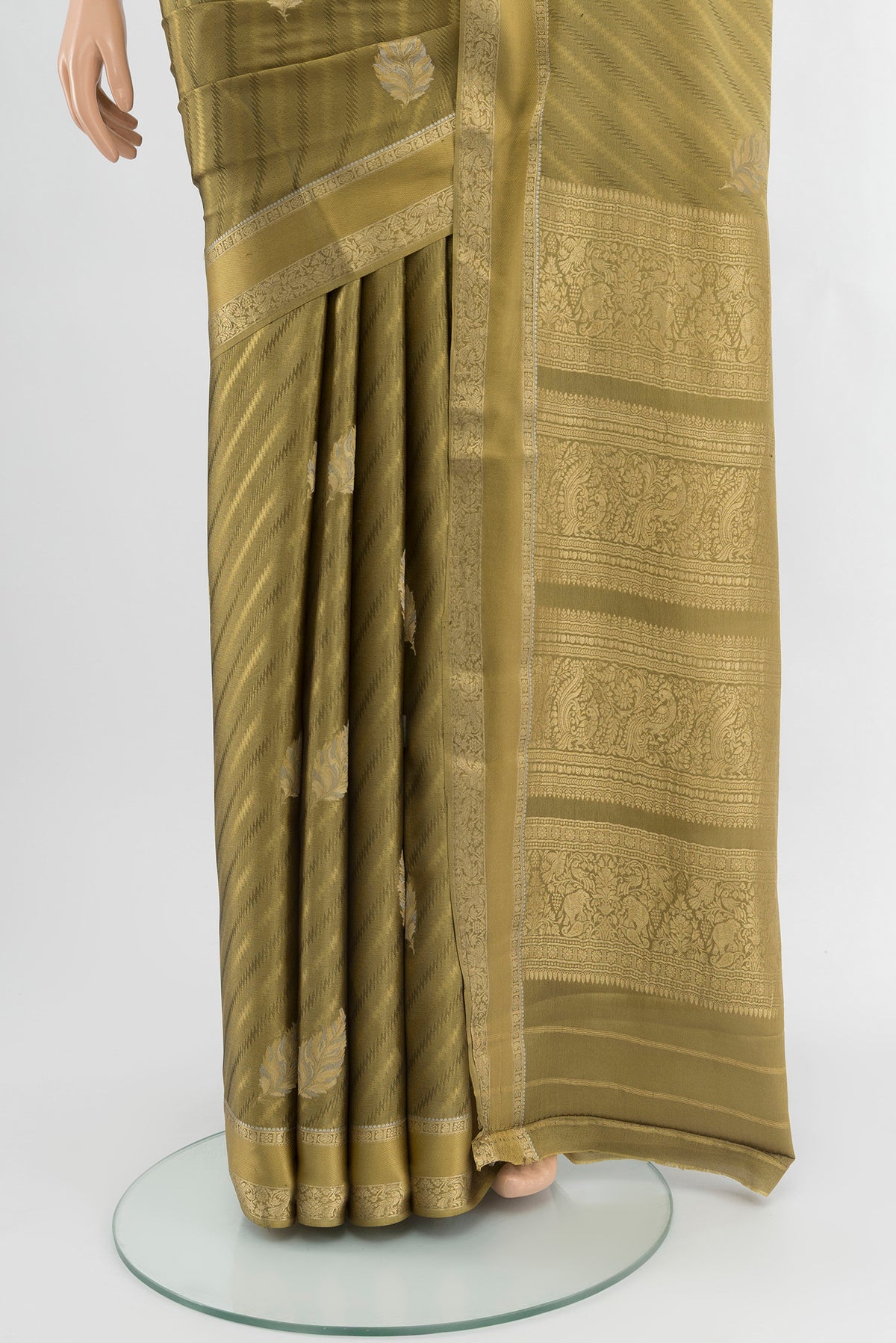 Pleats and pallu of Mehandi Green Mysore Crepe Saree with Zari Butta on the body and Zari Border. 