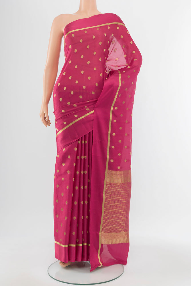 Bronze Mysore Crepe Saree with Zari Butta on the body and Silk Border.  displayed on a mannequin
