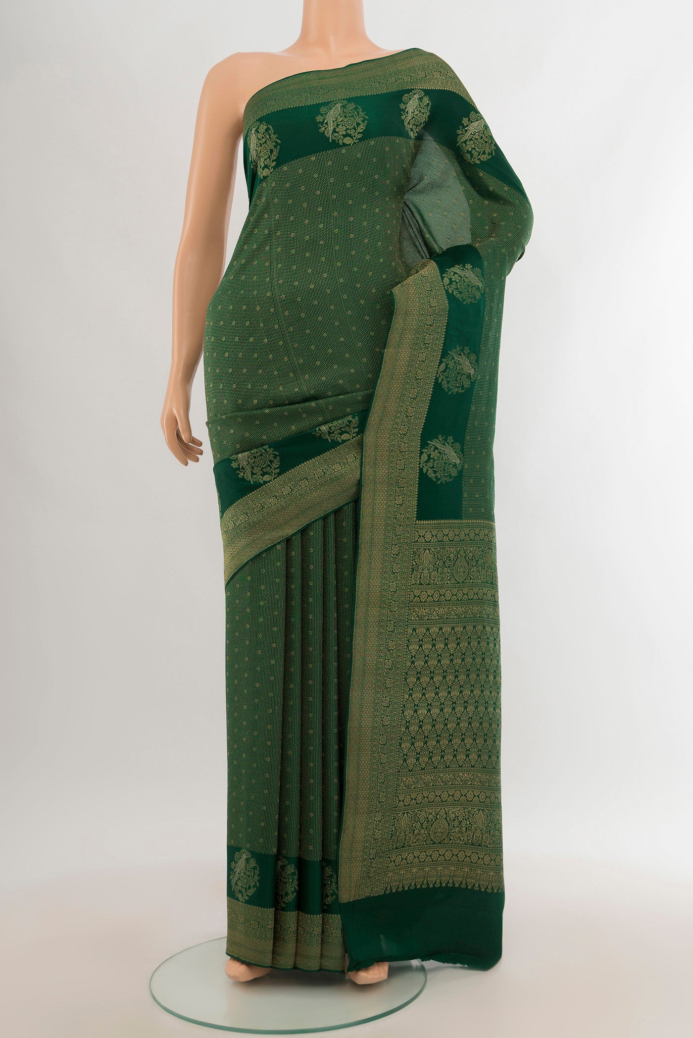 Bottle Green Mysore Crepe Saree with Zari Brocade on the body and Zari Border.  displayed on a mannequin