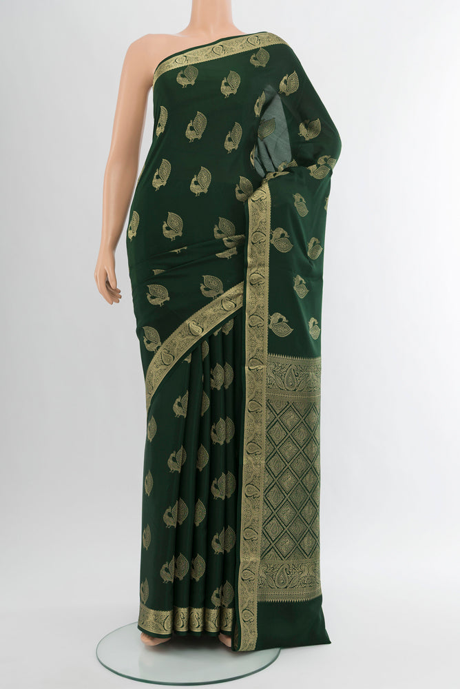 Pure Silk Pure Zari Mint Green Mysore Crepe Saree with Zari Butta on the body and Silk Border.  displayed on a mannequin
