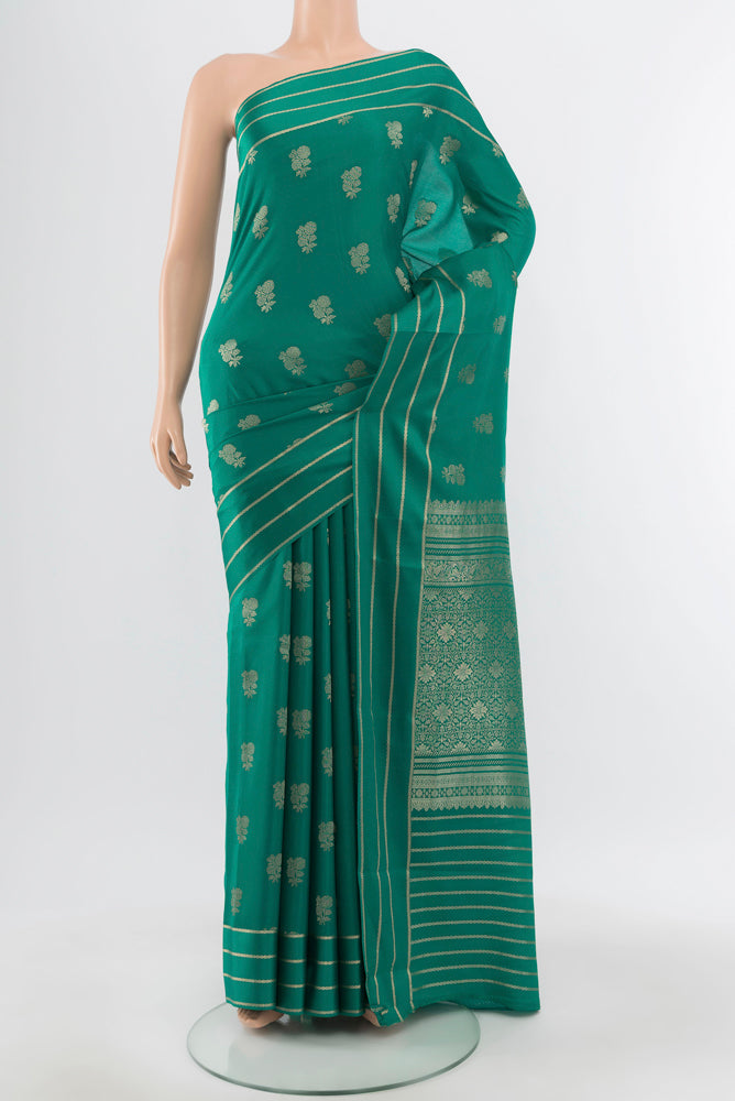 Pure Silk Pure Zari Dark Mauve Mysore Crepe Saree with Zari Butta on the body and Silk Border.  displayed on a mannequin