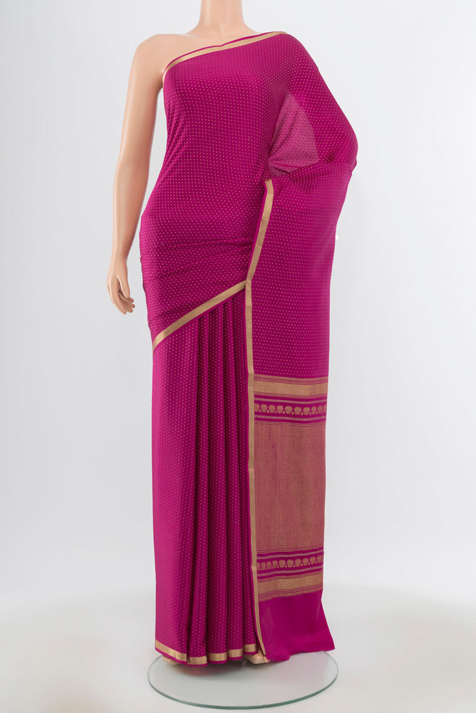 Pure Silk Pure Zari Magenta Mysore Crepe Saree with Zari Butta on the body and Silk Border.  displayed on a mannequin