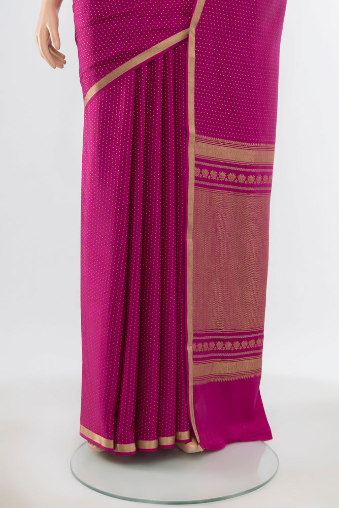 Pleats and pallu of Pure Silk Pure Zari Magenta Mysore Crepe Saree with Zari Butta on the body and Silk Border. 