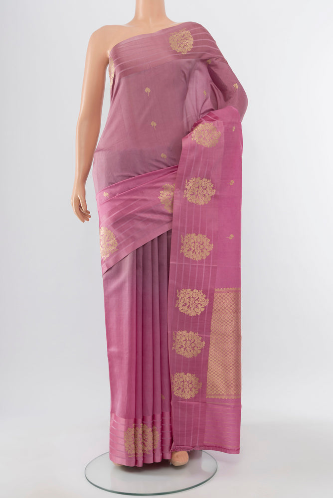Pure Silk Pure Zari Rose Gold Banarasi Katan Saree with Zari Butta on the body and Silk Border.  displayed on a mannequin