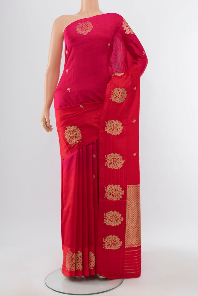 Pure Silk Pure Zari Red Banarasi Katan Saree with Zari Butta on the body and Silk Border.  displayed on a mannequin