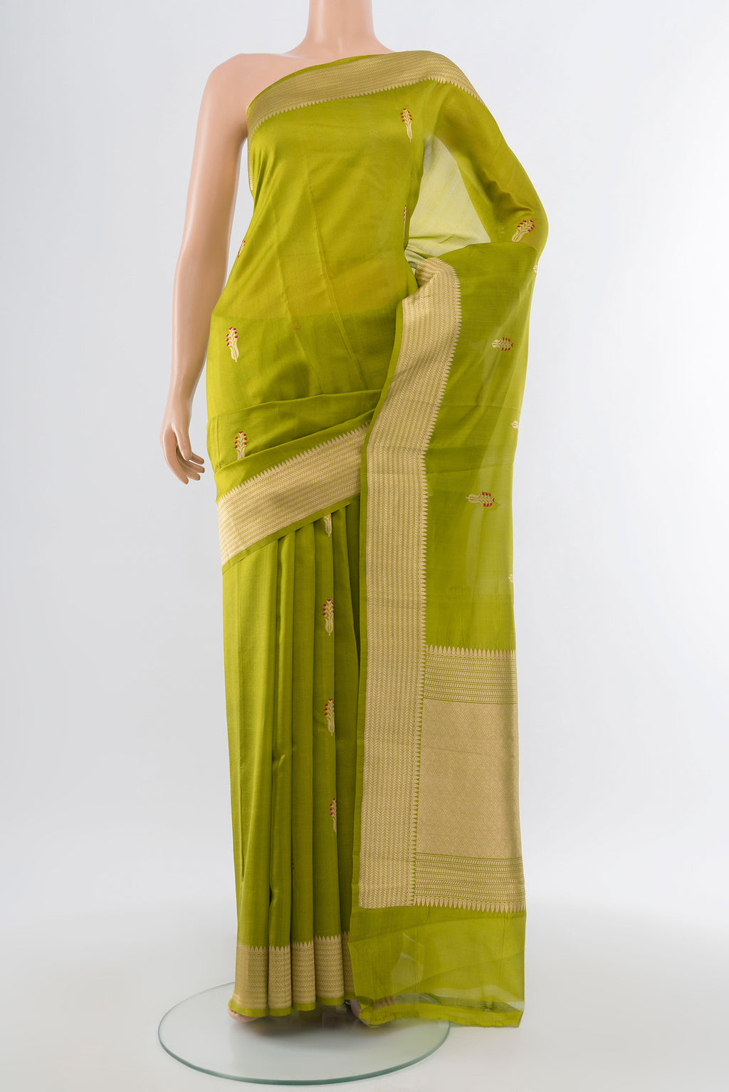 Light Green Banarasi Katan Silk Saree with Zari Butta on the body and Silk Border.  displayed on a mannequin
