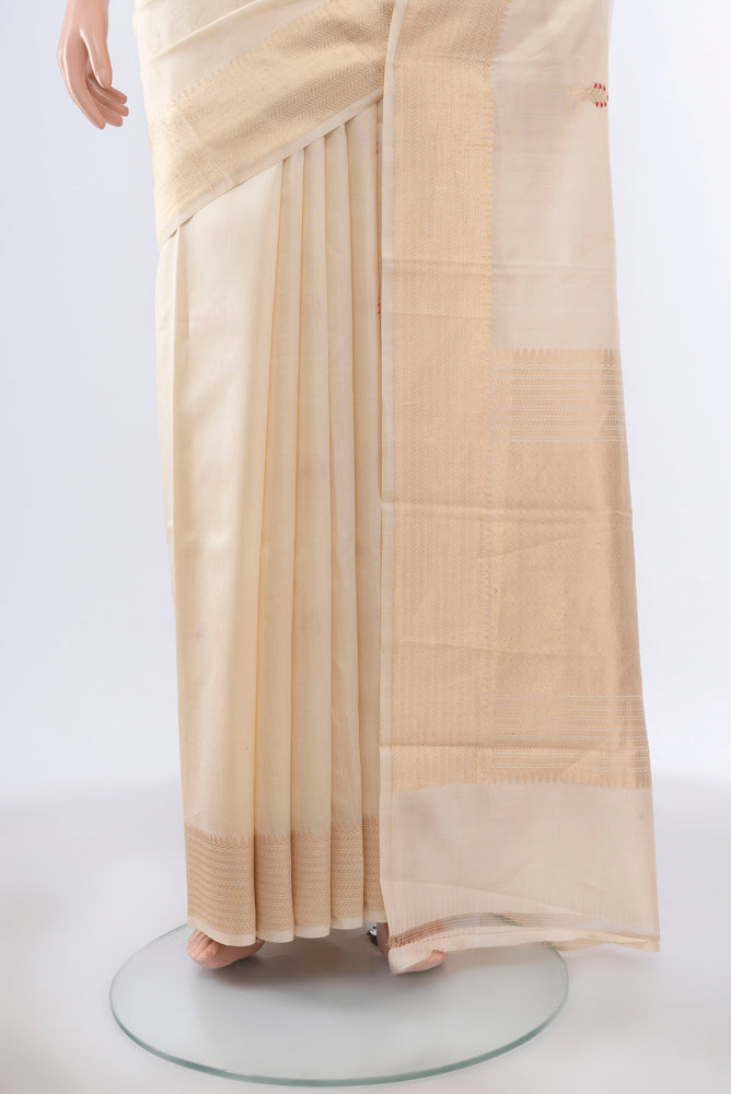 Pleats and pallu of Cream Banarasi Katan Silk Saree with Zari Butta on the body and Silk Border. 