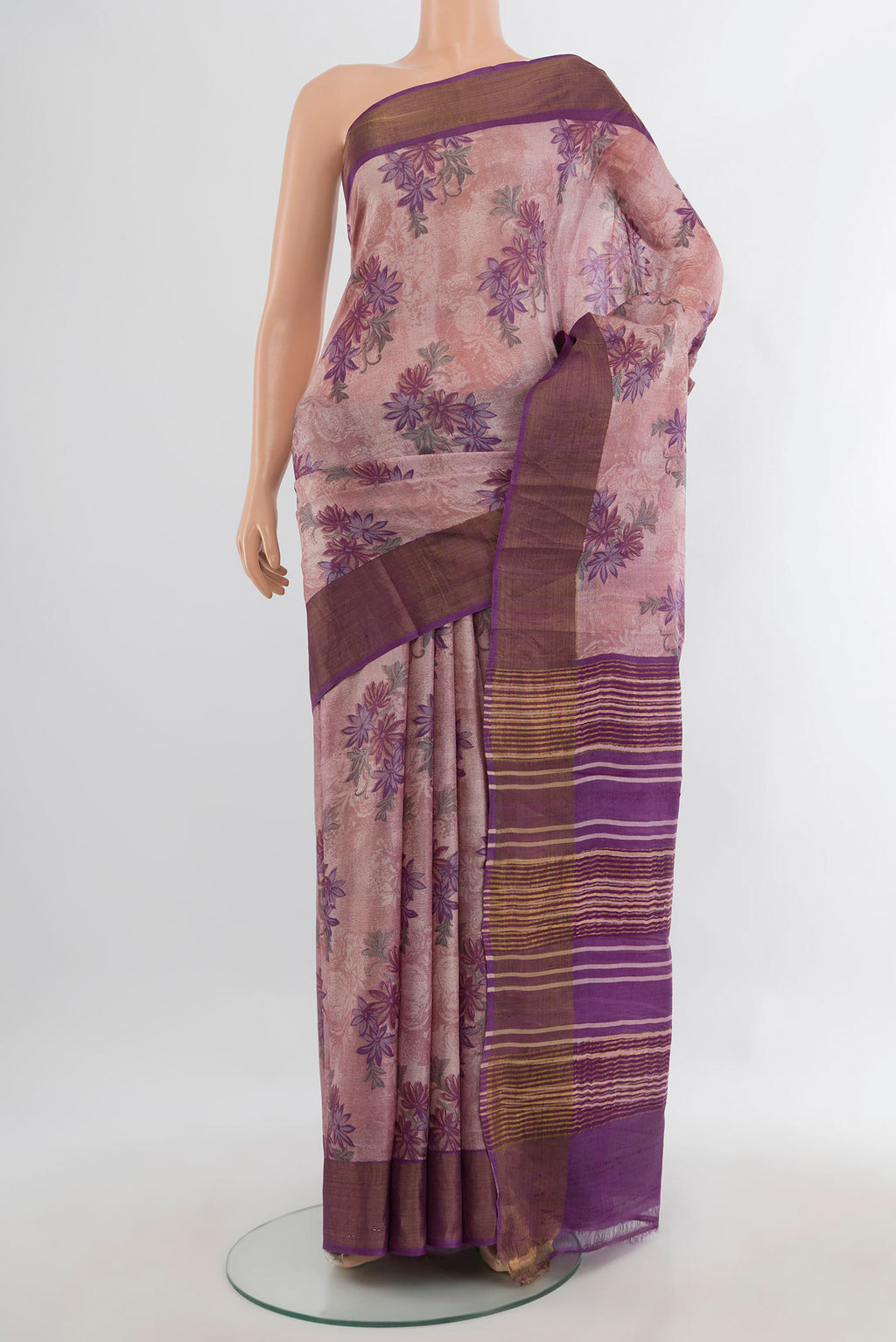 Rose Gold Tussar Saree with Floral Print on the body and Zari Border.  displayed on a mannequin