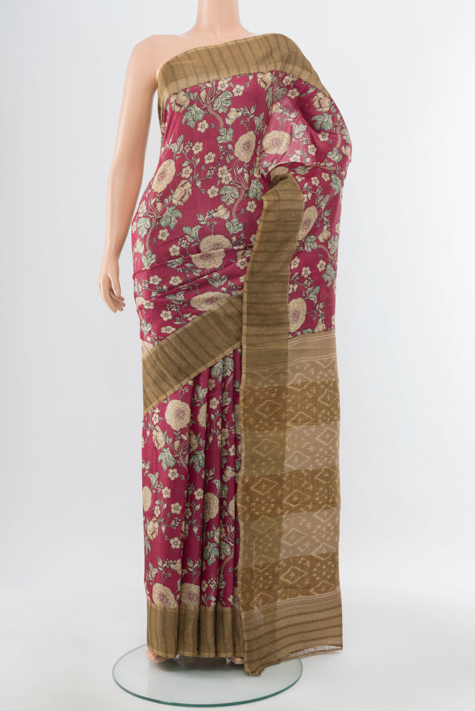 Bronze Tussar Silk Saree with Floral Print on the body and Silk Border.  displayed on a mannequin