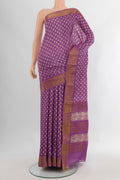 Violet Tussar Silk Saree with Floral Print on the body and Zari Border.  displayed on a mannequin