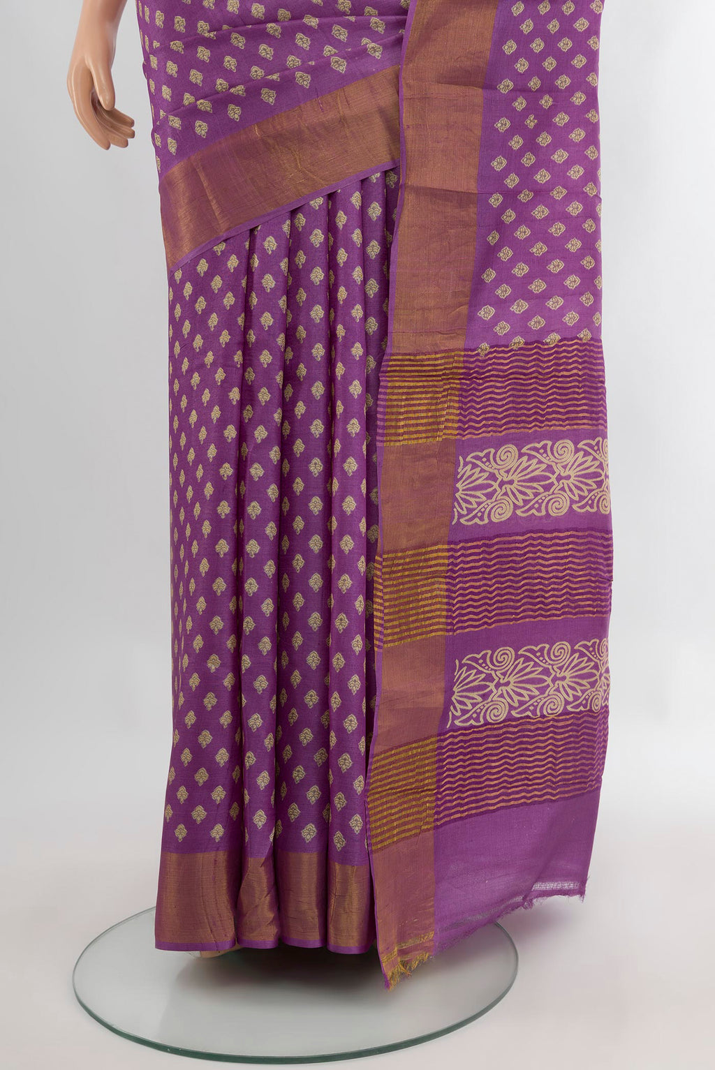 Pleats and pallu of Violet Tussar Silk Saree with Floral Print on the body and Zari Border. 
