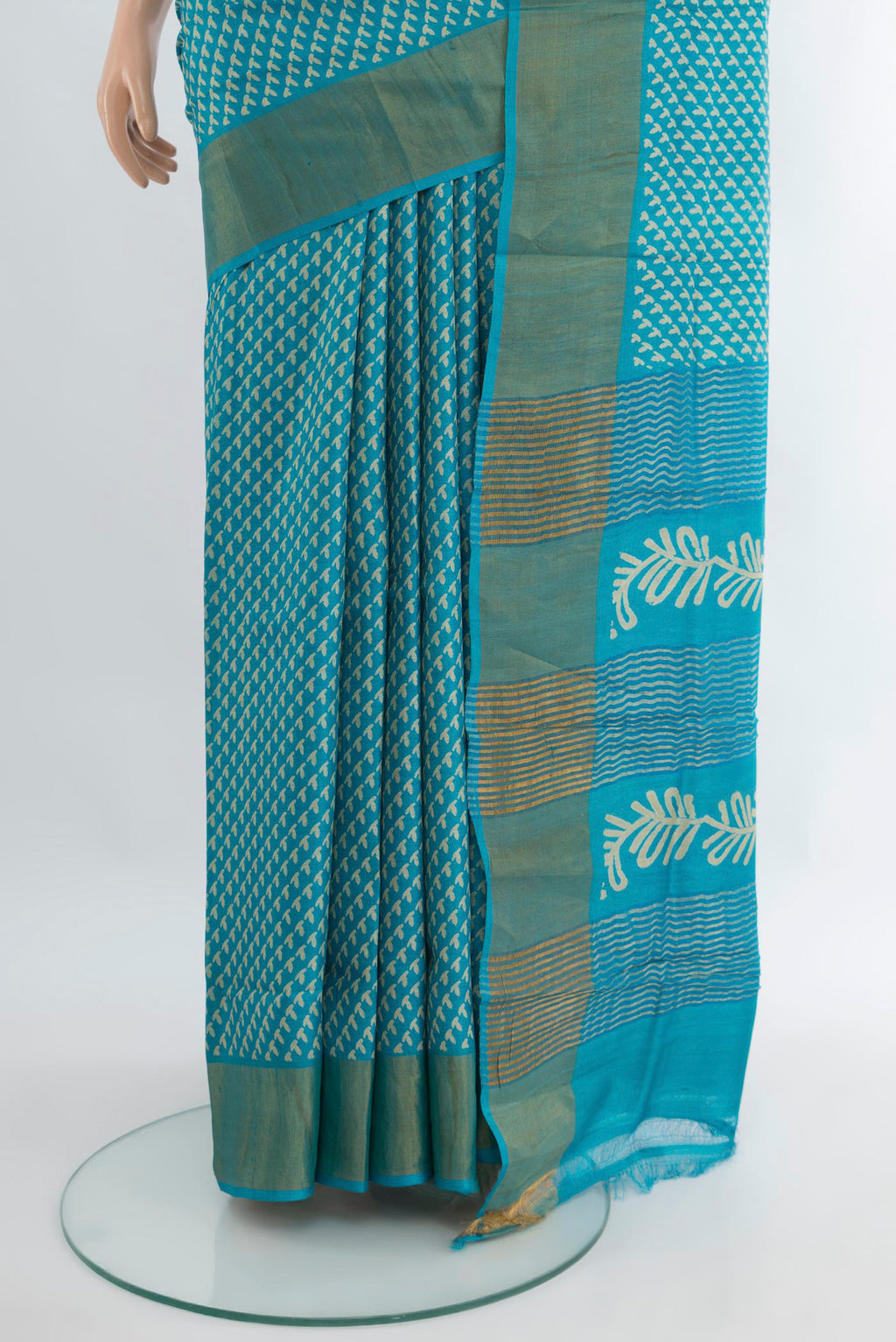 Pleats and pallu of Light Blue Tussar Silk Saree with Floral Print on the body and Zari Border. 
