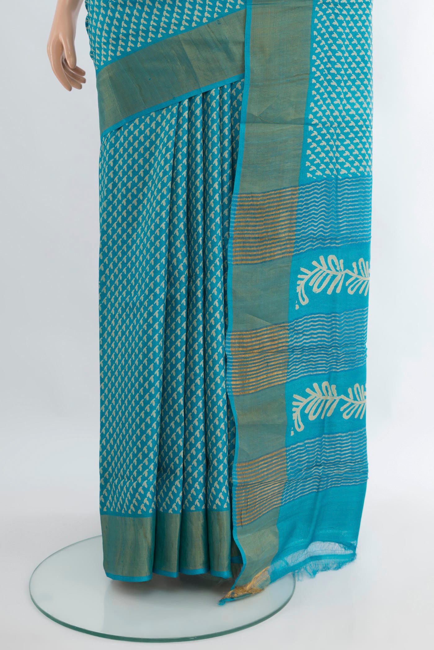 Pleats and pallu of Light Blue Tussar Silk Saree with Floral Print on the body and Zari Border. 