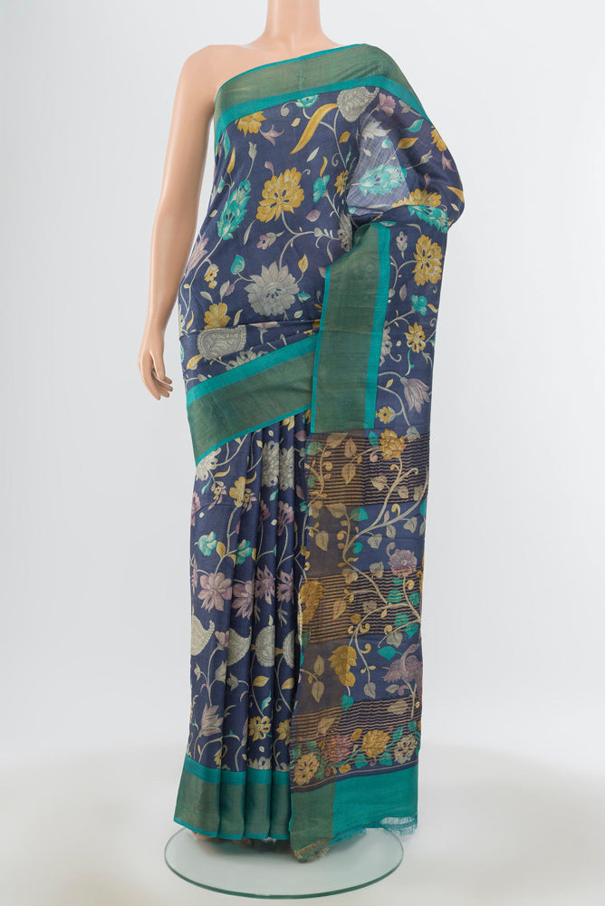Pure Silk Pure Zari Multi Color Tussar Saree with Floral Print on the body and Silk Border.  displayed on a mannequin
