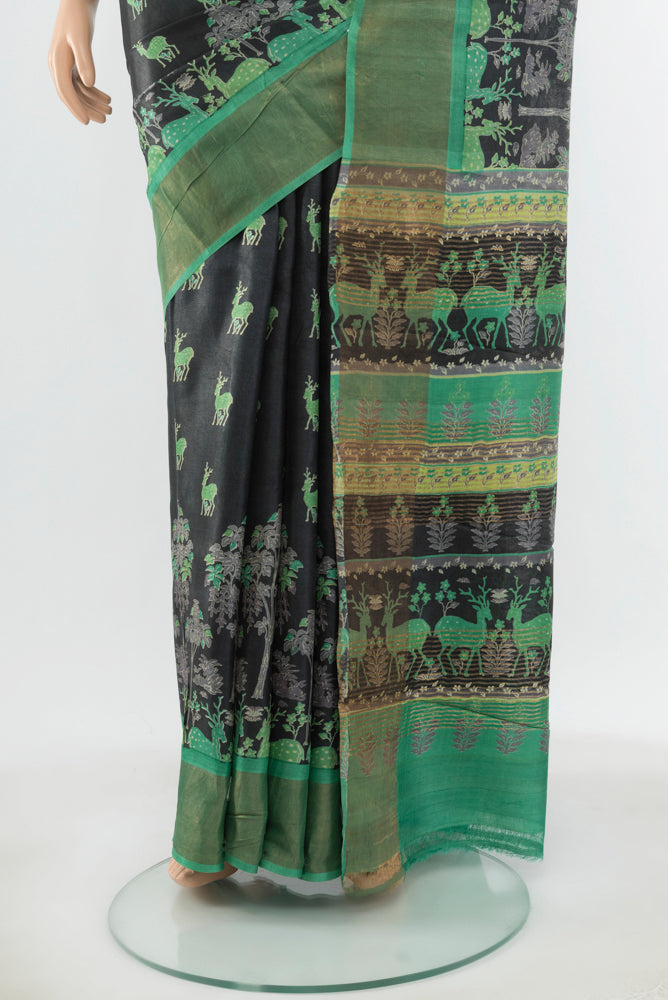 Pleats and pallu of Black Tussar Silk Saree with Floral Print on the body and Silk Border. 