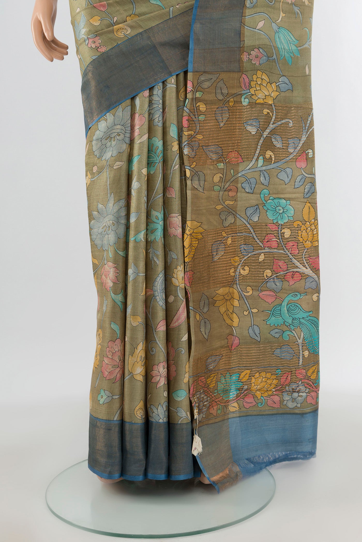 Pleats and pallu of Beige Tussar Silk Saree with Floral Print on the body and Zari Border. 