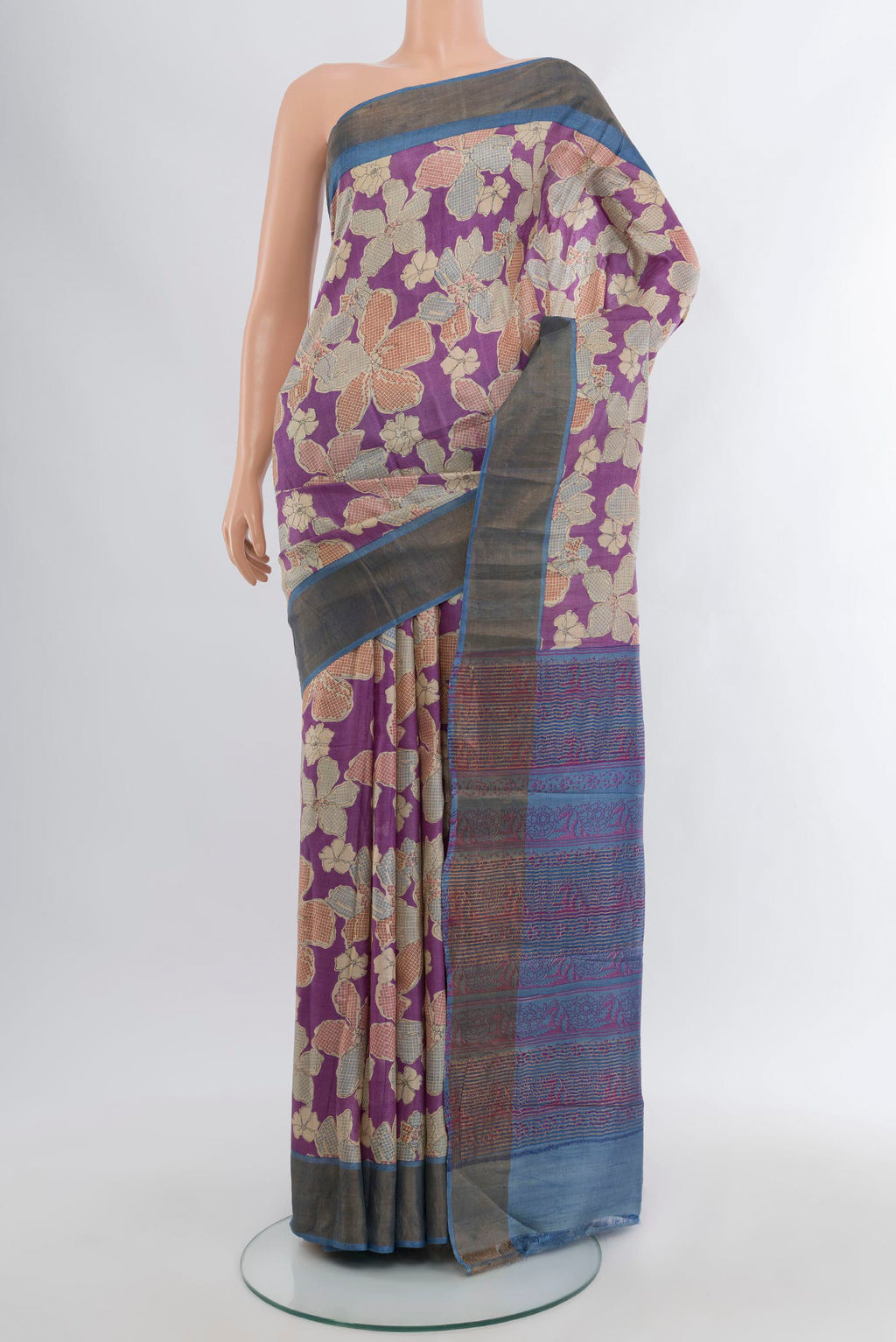Purple Tussar Silk Saree with Floral Print on the body and Zari Border.  displayed on a mannequin